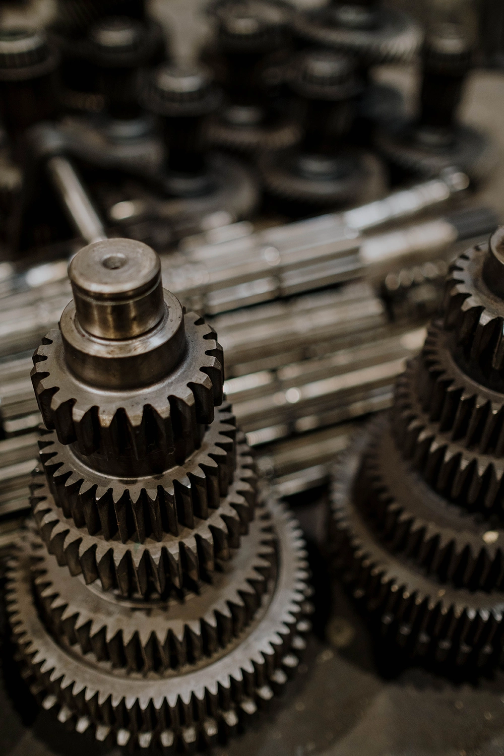 Machined gears and shafts of the type used in appliance drive assemblies